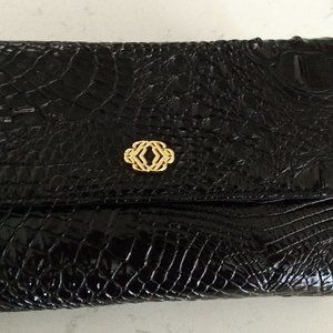 Multifunctional Clutch in black Embossed Alligator faux Patent Leather.